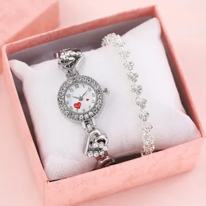 Silver quartz watch and heart-shaped rhinestone bracelet set in a pink gift box
