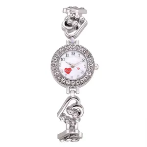 Macro view of silver dial with heart and love pattern on rhinestone watch for women