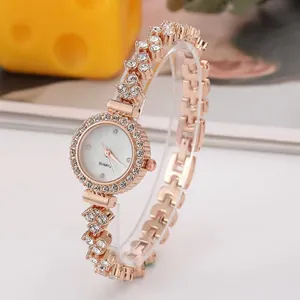 Elegante orologio da donna in oro rosa con cristalli scintillanti e quadrante bianco puro