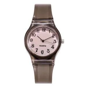 Detailed view of the clear grey silicone strap and white dial with bold black numerals