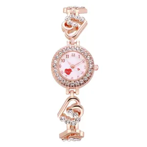 Close-up of rose gold heart-shaped bracelet watch band with sparkling crystals
