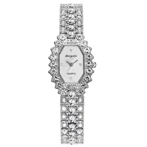 Detail of a square silver quartz watch with glittering rhinestones and a metal bracelet