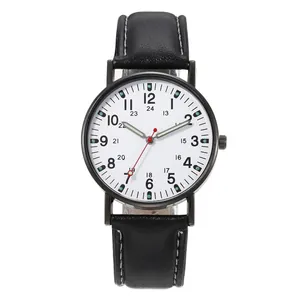 Detail view of quartz watch with white dial, luminous hands and black leather strap