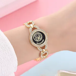 Montre-bracelet en Alliage d'Or avec Strass pour Femmes Montre à Quartz Élégante Motif Fleur Bijoux Cadeau