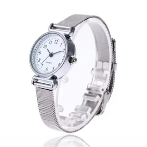 Detail of silver Milanese mesh strap and white dial of a minimalist quartz watch