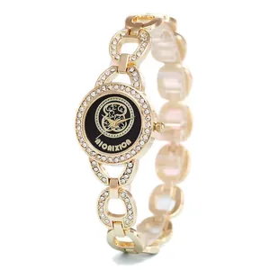 Montre quartz dorée élégante pour femme avec strass et bracelet à maillons évidés