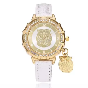 Gold owl pendant watch with diamond-encrusted bezel and white leather strap for women