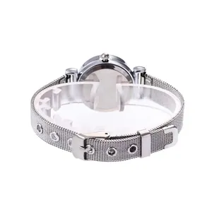 Detail of silver mesh bracelet and buckle on a minimalist women's watch with polished finish