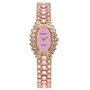Detail of rose gold octagon watch face with crystal bezel and pink gemstone bracelet