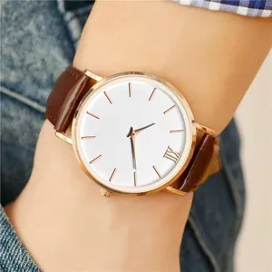Minimalist leather strap quartz watch with rose gold case and simple white dial