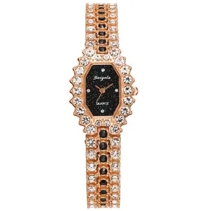 Close-up of rose gold octagonal quartz watch featuring crystal-encrusted case and band