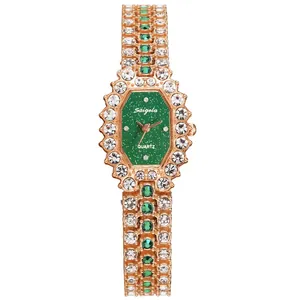 Women's rose gold watch with octagonal green dial and crystal-studded bracelet band
