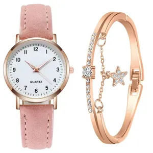 Dettaglio orologio al quarzo rosa con quadrante numerico e set bracciale stella