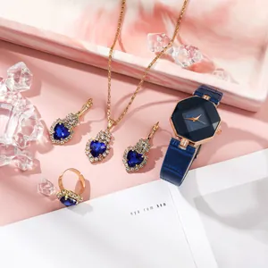 Elegant gold jewelry set with blue heart gems and matching leather strap quartz watch