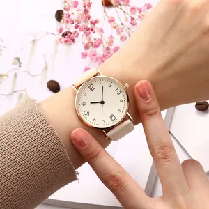 Minimalist women's quartz watch with cream leather strap and large Arabic numerals