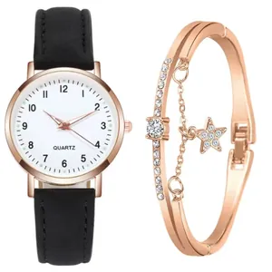 Dettaglio dell'elegante orologio al quarzo nero e del bracciale a stella in oro rosa