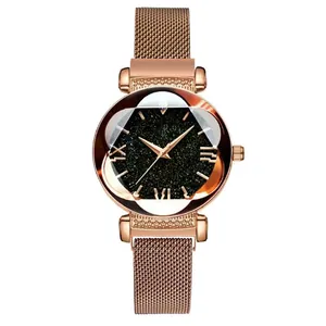 Detail of rose gold magnetic Milanese strap and faceted star-patterned dial on woman's watch