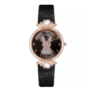 Detail of rose gold watch case featuring rhinestone hearts and a crystal bunny on dial