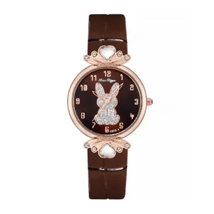 Detail of quartz watch featuring a glittery rabbit motif and heart-shaped gemstone accents