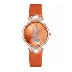 Orange leather strap watch with rose gold case and glittery rabbit pattern dial for women
