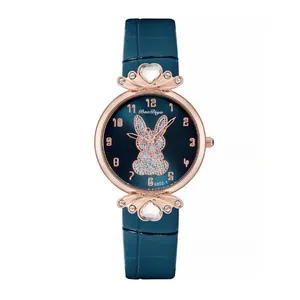 Women's watch with navy blue strap, rose gold case, and glittery rabbit pattern on dial