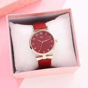 Close-up of Tadi ladies' watch with red leather strap in a pink gift box with soft pillow