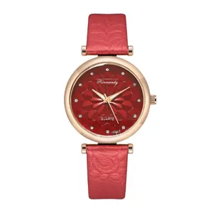 Close-up of starry sky watch dial with red floral texture and rose gold casing