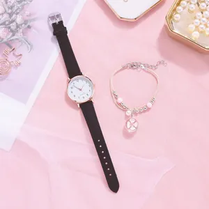 Close-up of women's quartz watch with black strap and floral charm bead bracelet