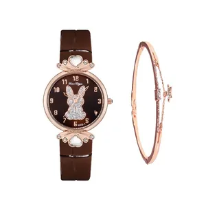 Detail of rose gold rabbit dial watch with matching star charm bracelet gift set