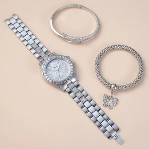 Close-up of a silver-tone women's watch set with rhinestone bezel and matching bracelets