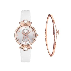 Close-up of white quartz watch set with crystal heart bezel and star charm bracelet