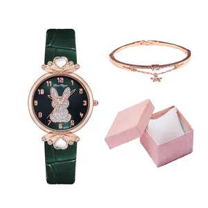 Women's rose gold watch set with crystal rabbit dial and green leather strap in a gift box