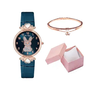 Women's quartz watch gift set with blue leather strap, rabbit dial and star bracelet