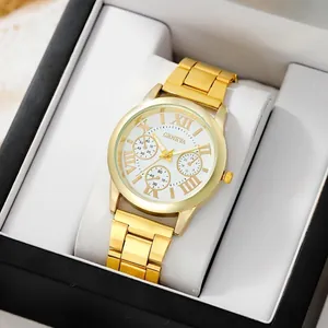 Montre élégante en métal doré avec cadran blanc à chiffres romains dans son écrin