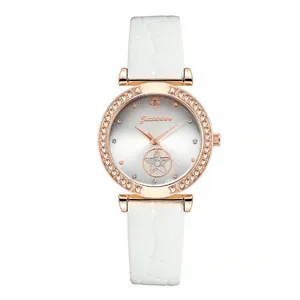 Detail of rose gold watch with sparkling rhinestones and white crocodile leather strap