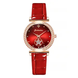 Detail of red leather watch strap with rose gold bezel and starry dial decoration