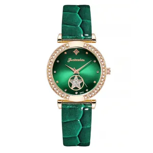Macro view of green radial dial with star cutout and sparkling crystal bezel detail