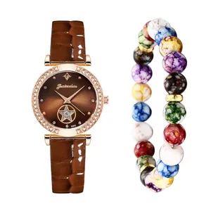 Close-up of quartz watch with rhinestone bezel and colorful beaded bracelet accessory