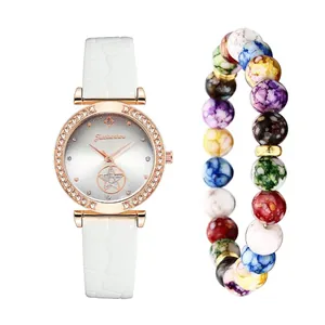Women's quartz watch with diamond dial and colorful bead bracelet set on white background