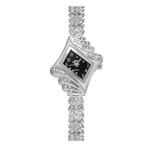 Detailed macro shot of a silver rhombus dial quartz watch with crystals and leaf-shaped band