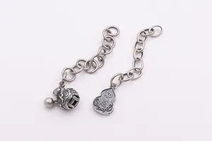 Detail of S925 sterling silver tassel chain with hollow bell and gourd charms
