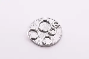 Macro shot of S925 sterling silver jump rings in multiple sizes on a reference coin