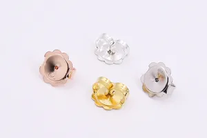 Detailed macro view of S925 sterling silver flower earring backs in four metallic finishes