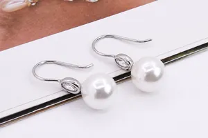 Macro detail of S925 sterling silver earring hook setting with cubic zirconia mounting