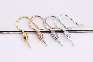 Macro detail of S925 sterling silver ear hooks with CZ stones in four metallic finishes