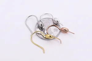 Macro detail of S925 sterling silver ear hooks in silver gold and rose gold finishes