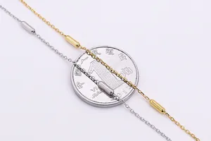 Close-up of S925 sterling silver cylinder bead necklaces in gold and silver finishes