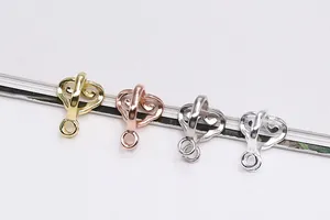 Detailed view of cloud-patterned S925 silver jewelry clasps in four metallic colors