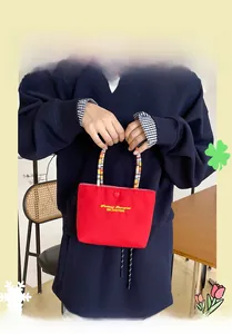 Mini red canvas handbag with colorful beaded handle and Fantasy Romance embroidery