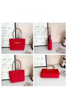 Detail view of red tote bag with colorful woven handles and secure snap button closure